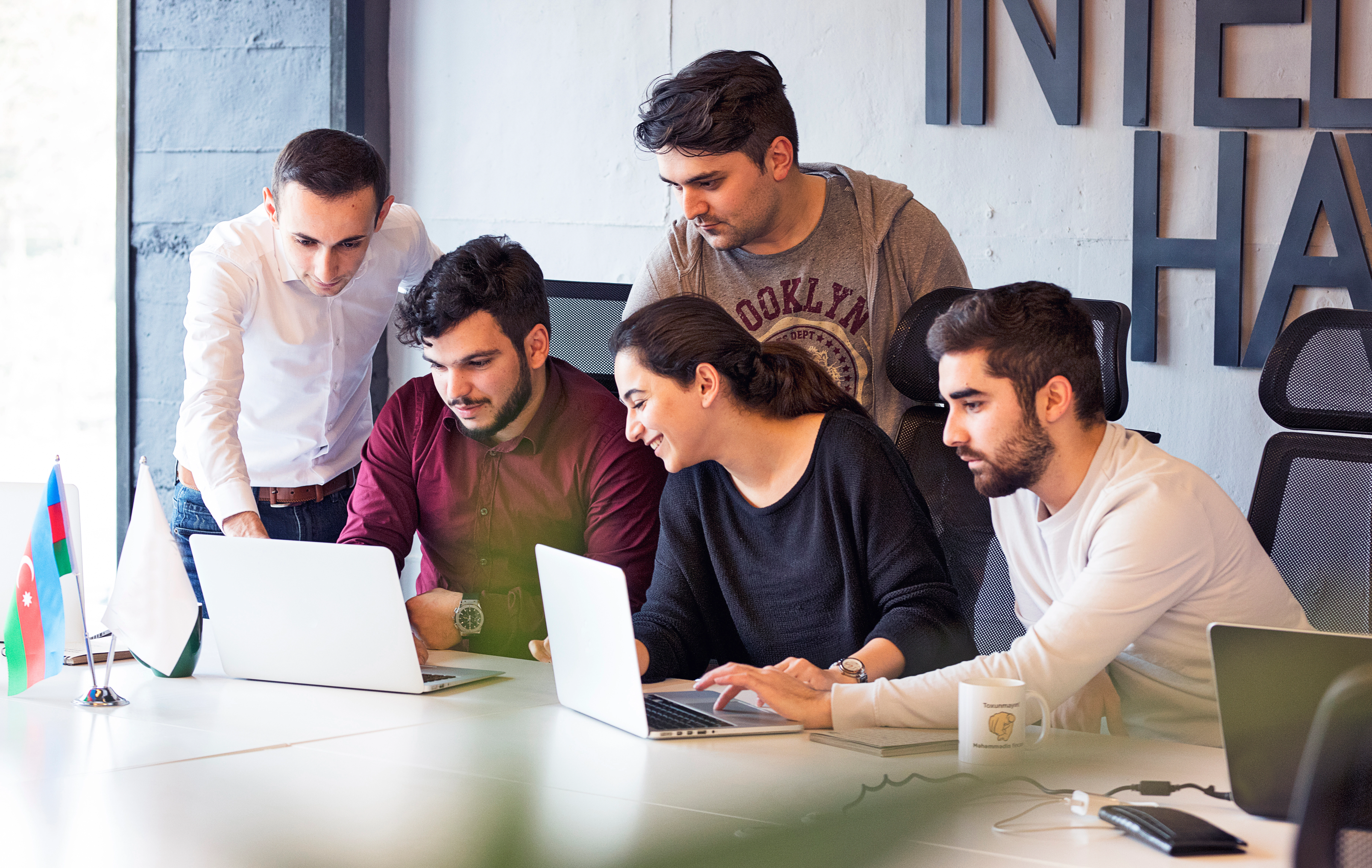 Techtrix consultants working with a client team in a meeting room
